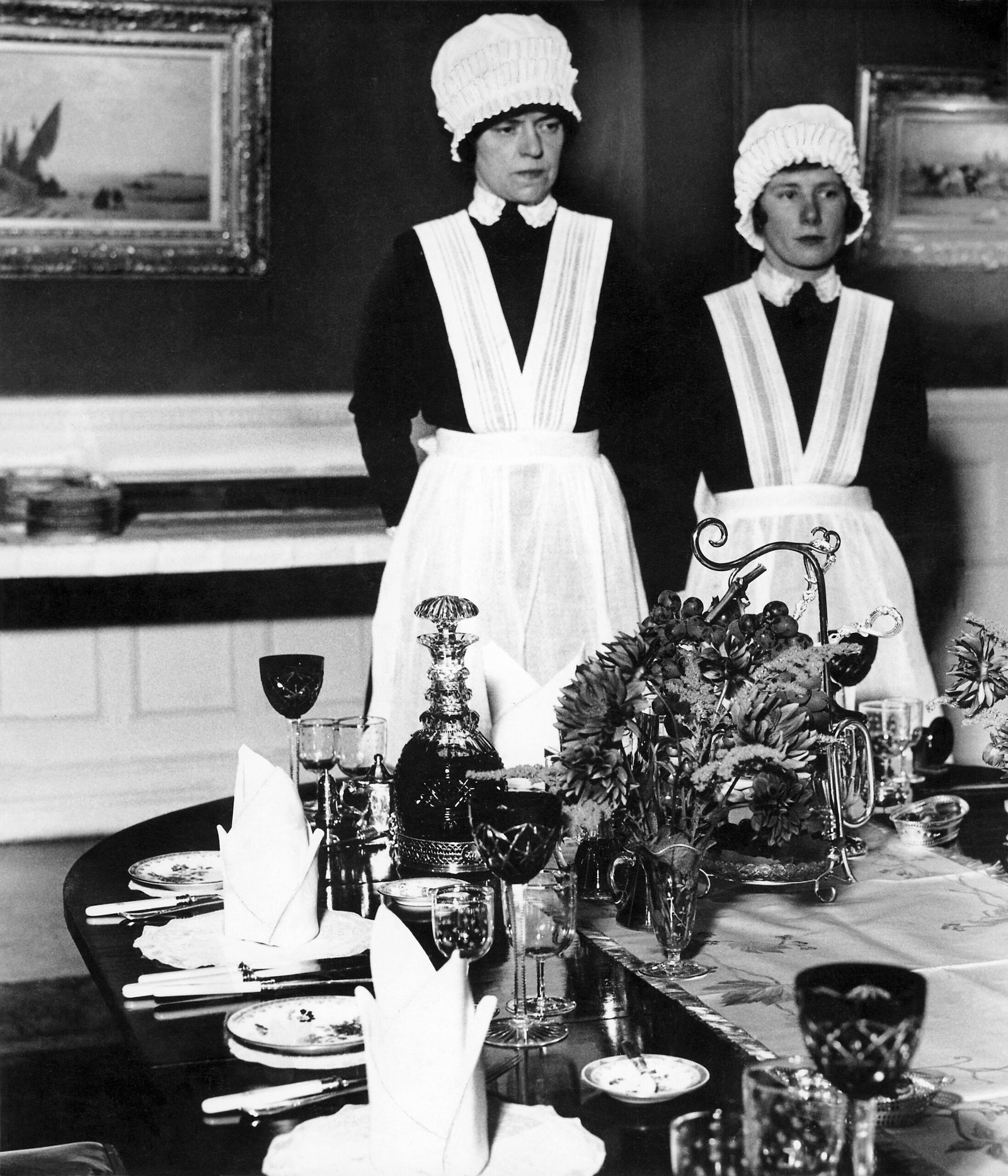 Parlourmaid and Under Parlourmaid ready to serve dinner 1939