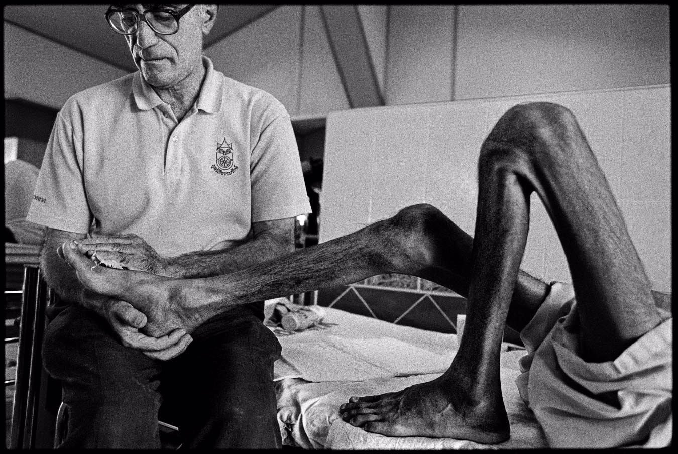 nachtwey–he-bathes-the-feet-of-an-aids-patient-from-the-series-father-mike.4811829605957508011